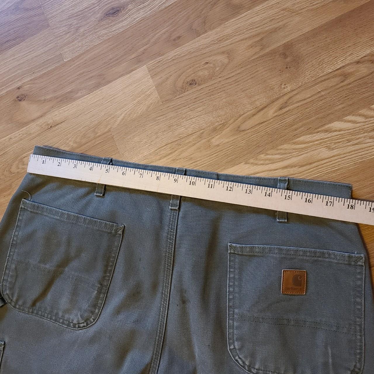 Gray green distressed carharrt pants. Size 36x38.... Depop