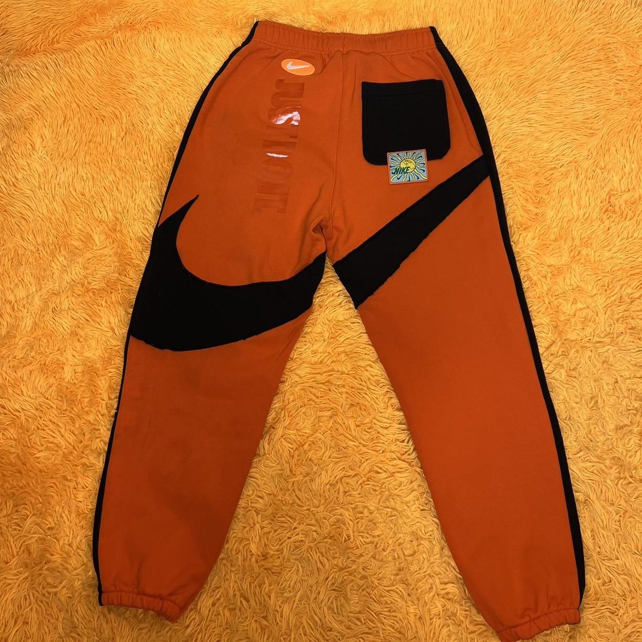 orange and black nike sweatsuit