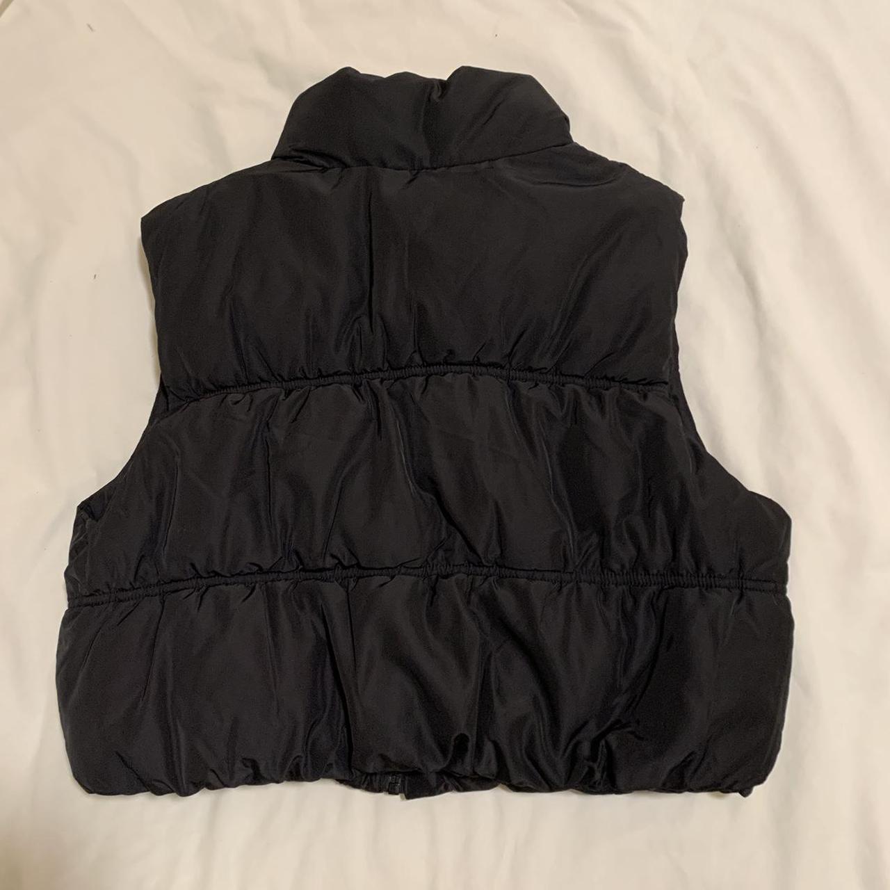 Black cropped puffer vest. Size medium. Worn less... Depop