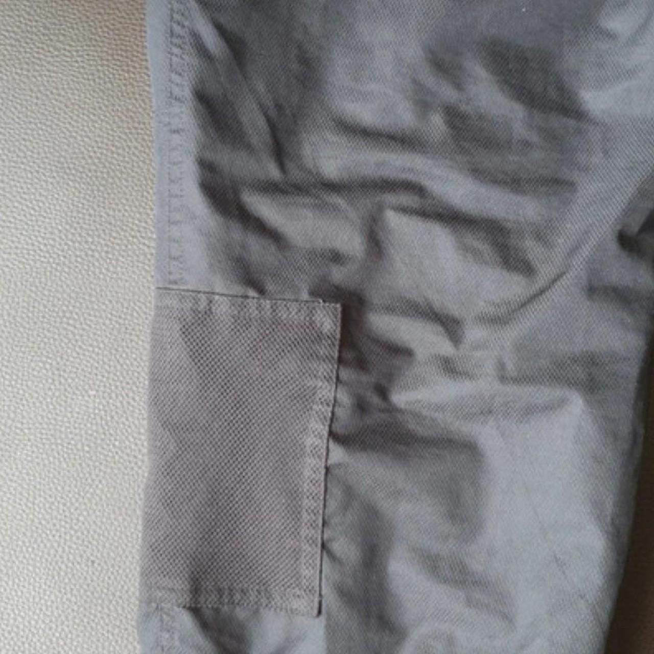 New Balance cargo trousers Black over... - Depop