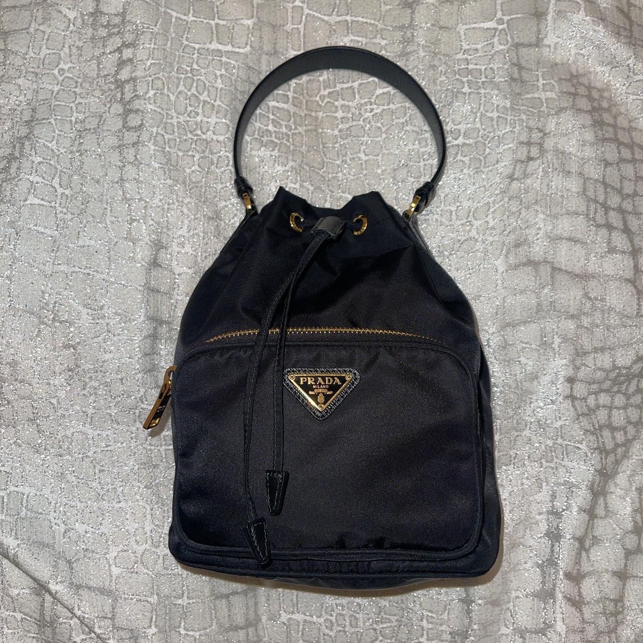 Prada duet re nylon bucket bag in black with gold. Depop