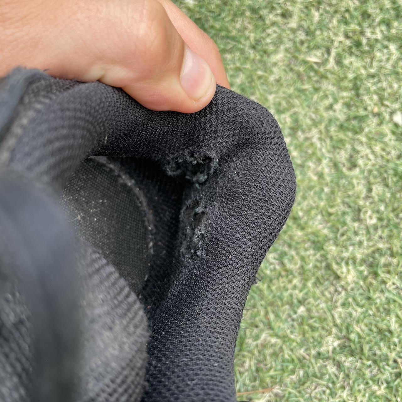 triple black nike tailwind