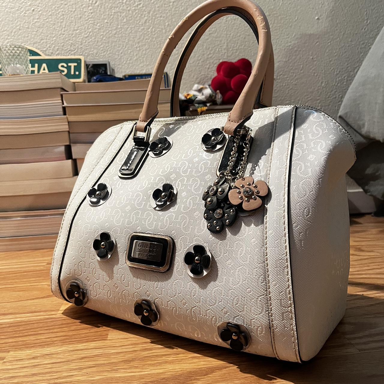 Guess bag with flower charms Handles have a bit of