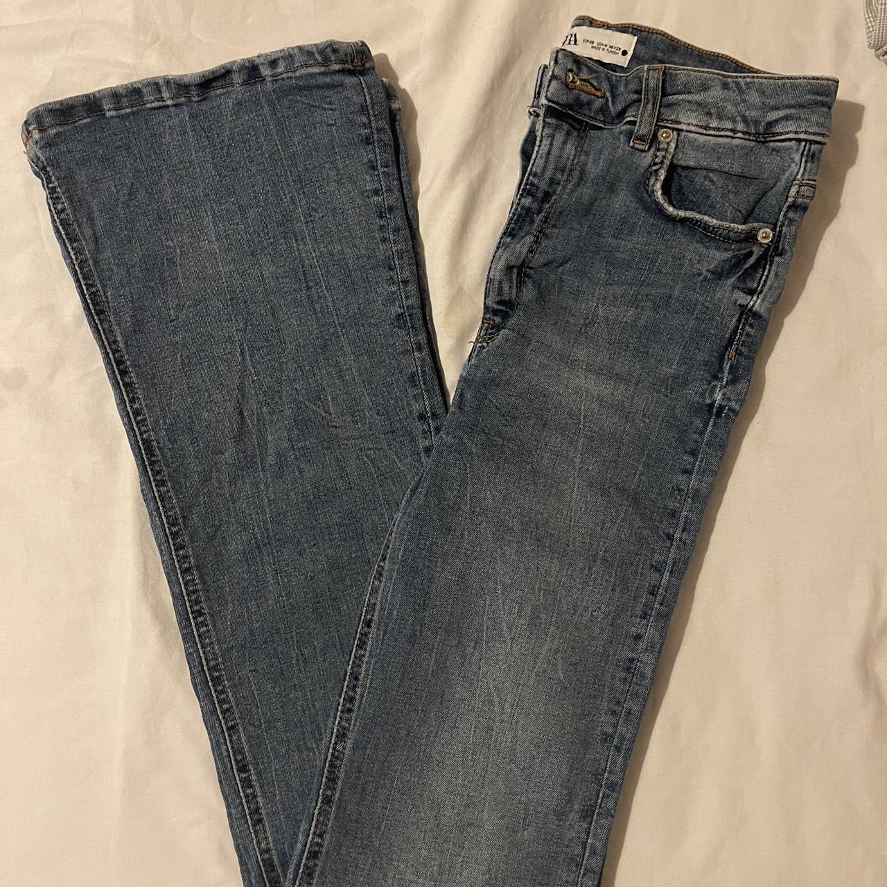 denim high-waisted flared jeans - has a tear on the... - Depop