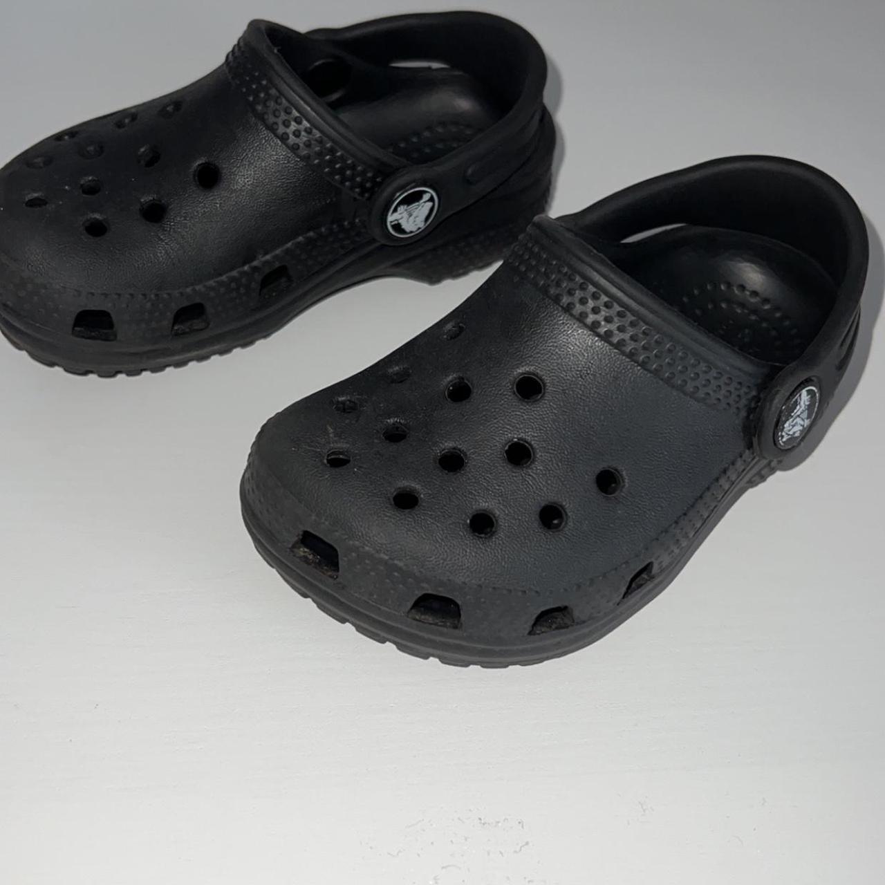 Unisex size 6 infant kids black crocs have been worn... - Depop