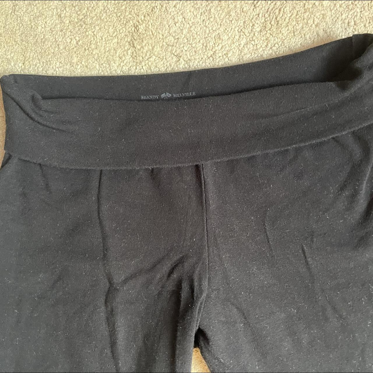 Black Brandy Melville yoga pants, flared with turned... - Depop