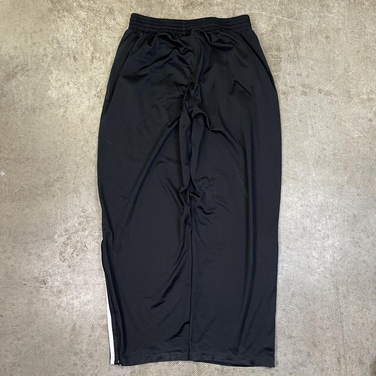 Nike baggy tracksuit bottoms joggers black size... Depop