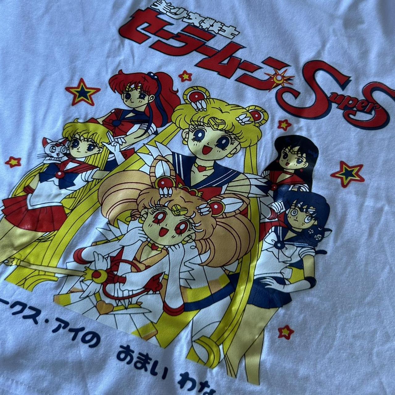 sailor moon crop top, never worn. Label says L but... - Depop