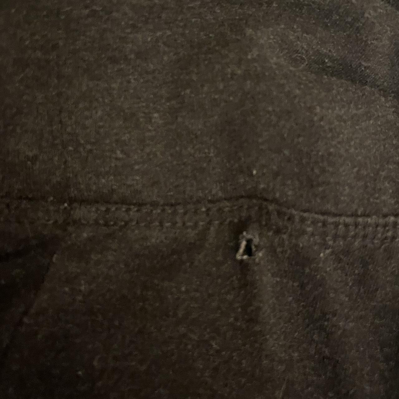Dark grey fold over flare leggings has a tiny hole... - Depop