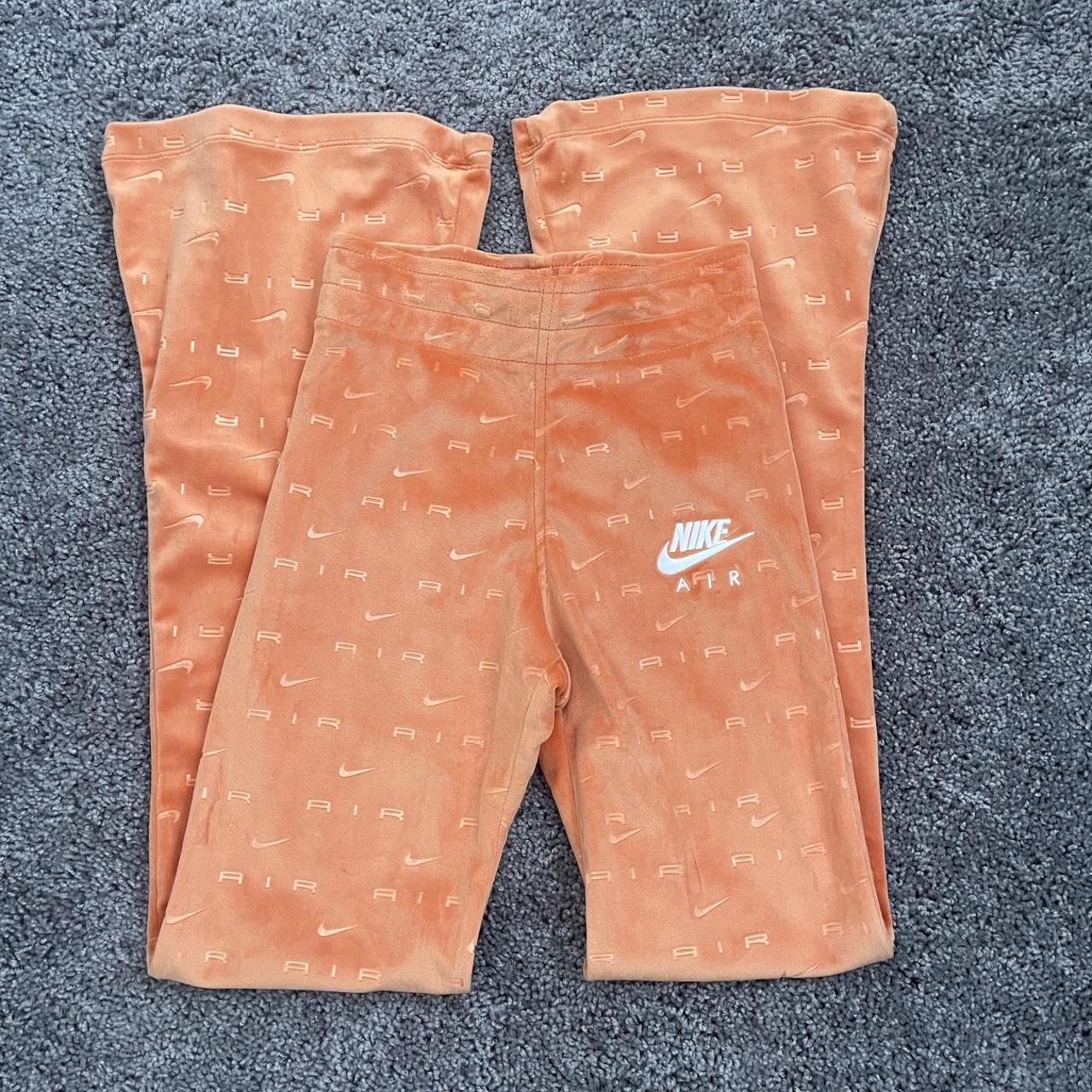 The cutest Nike orange velvet flare pants Never Depop