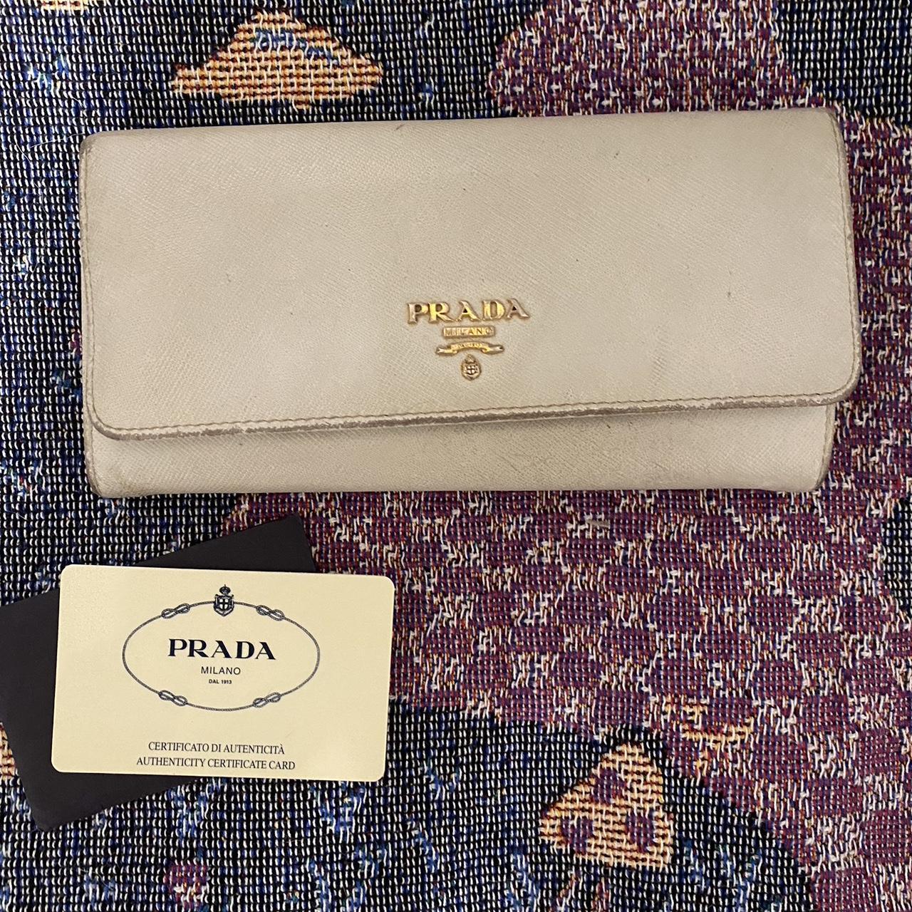 Prada saffiano metal long wallet Fairly worn hence