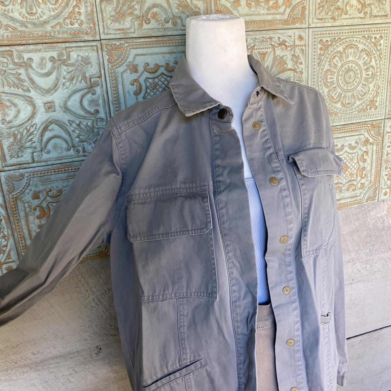 Size medium grey utility jacket with lots of... Depop