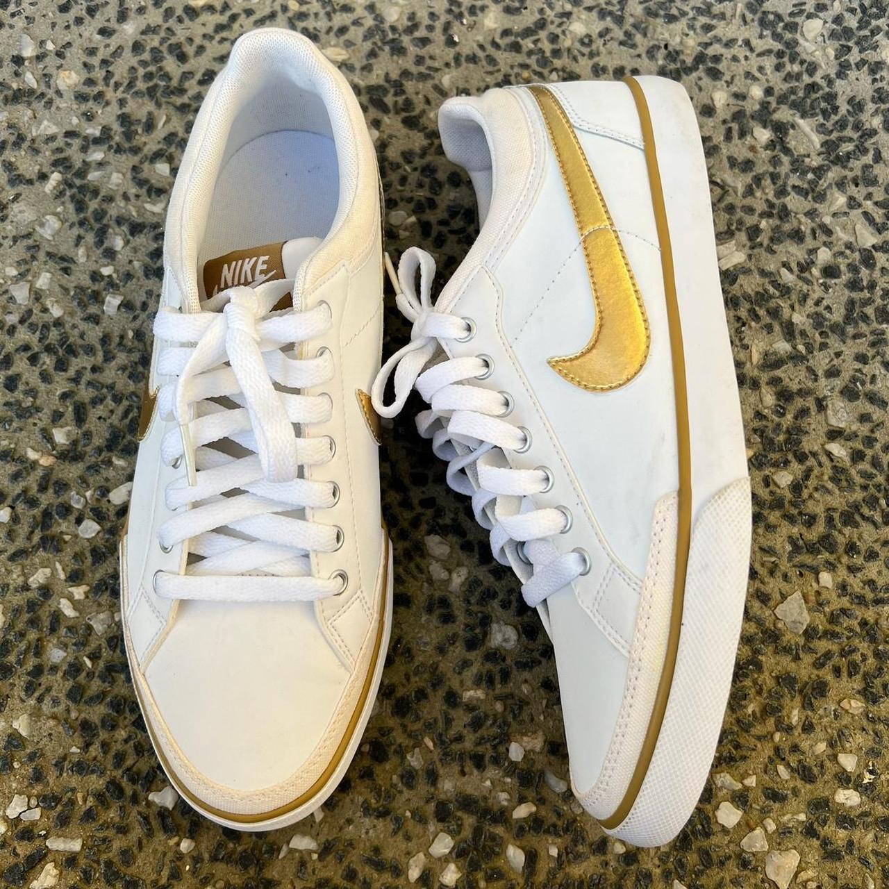 White nike outlet with gold tick