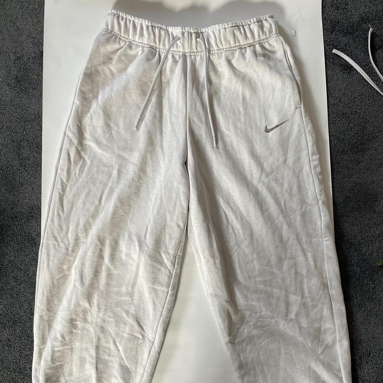 Nike loose fit mid rise white joggers with colourful... Depop