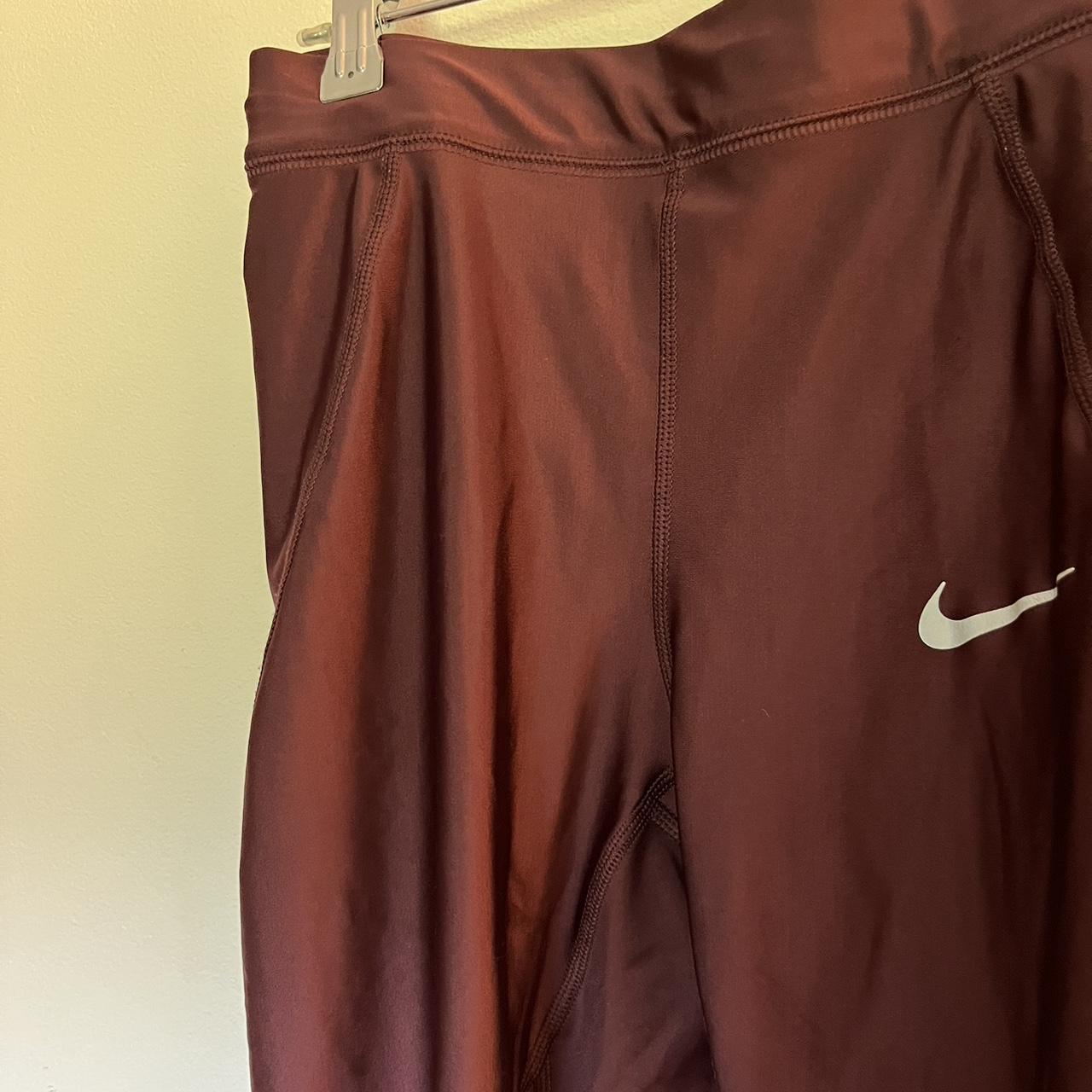 Shiny maroon nike leggings size small - Depop