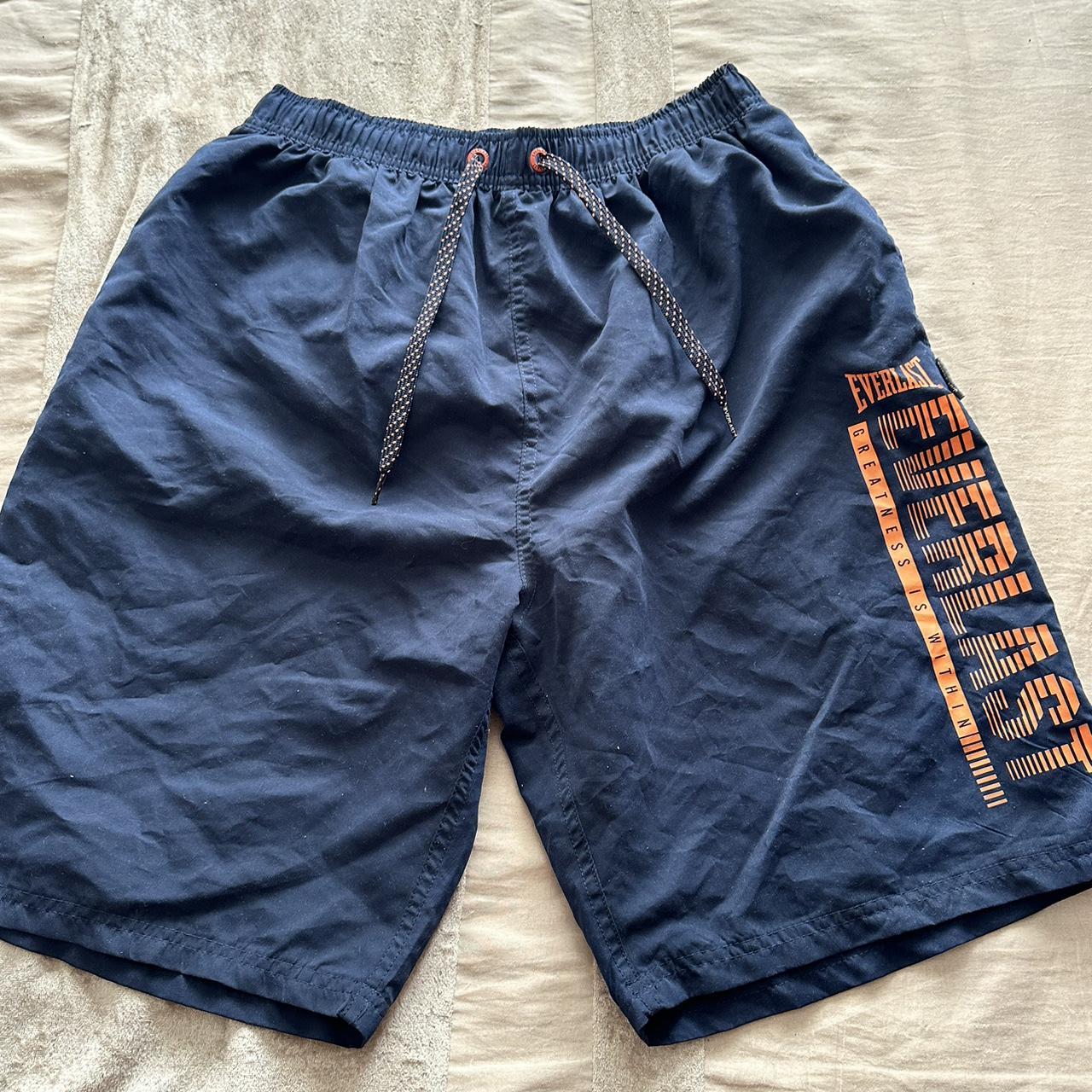 Navy blue Everlast swimming shorts with orange. Depop