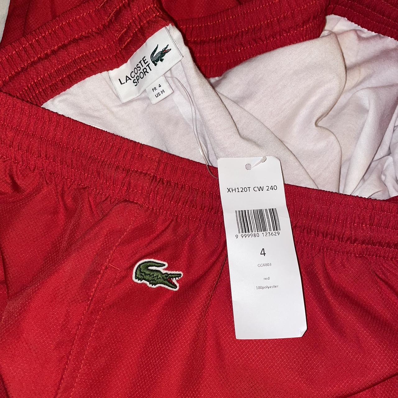 Lacoste tracksuit bottoms old badge in red... - Depop