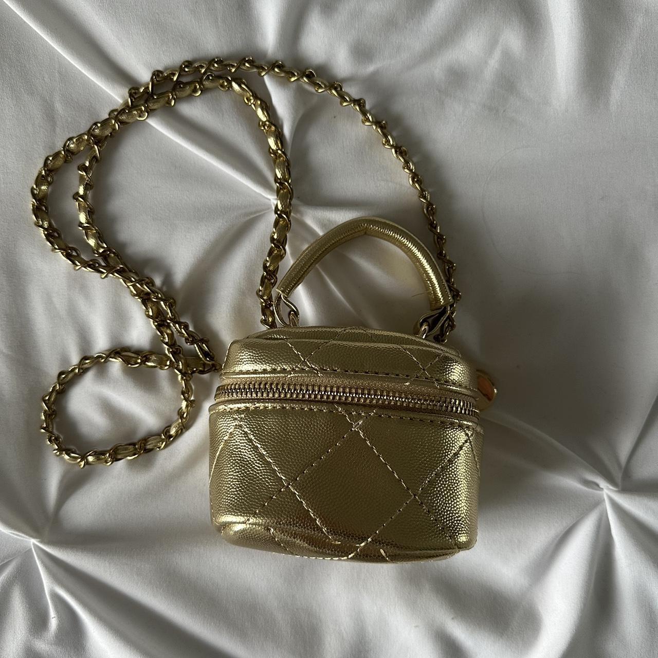 Gold cross body bag. Depop