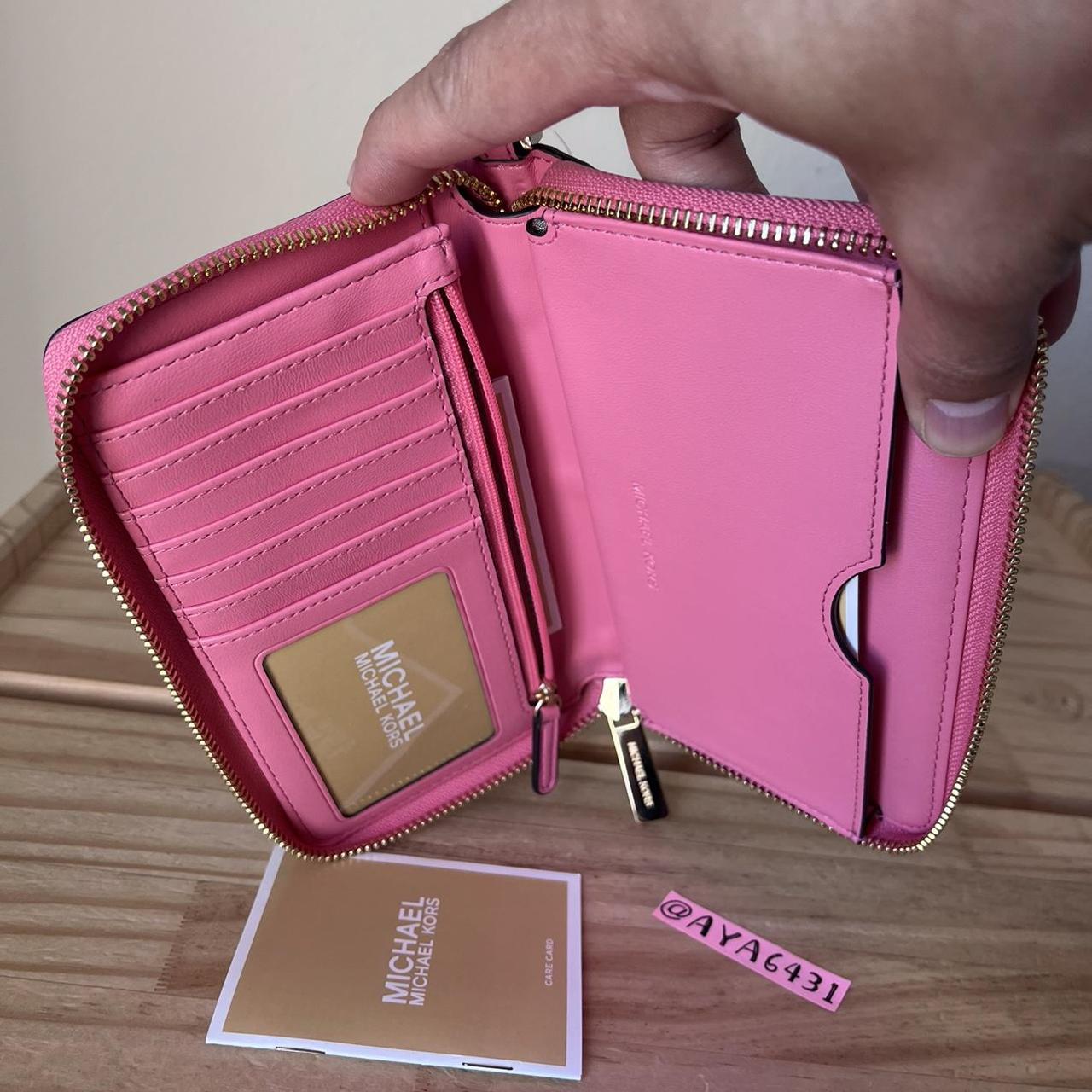 Hot pink Michael Kors wallet. Has six card holder - Depop