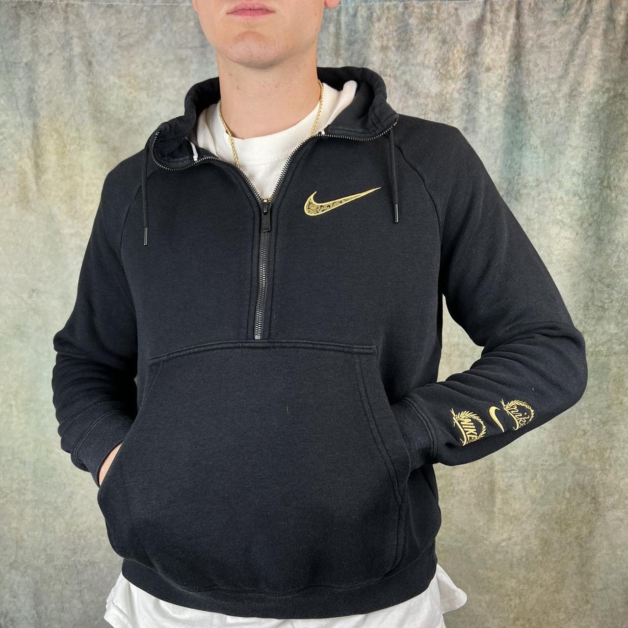 Nike sweatsuit best sale black and gold