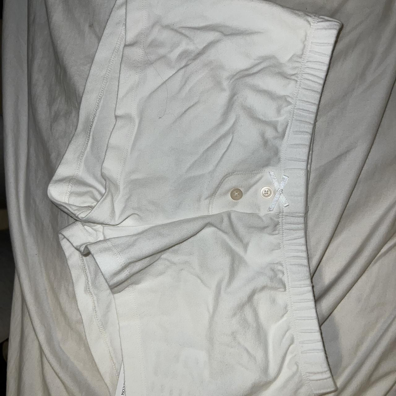 Brandy Melville White sleep shorts with white bow on... - Depop