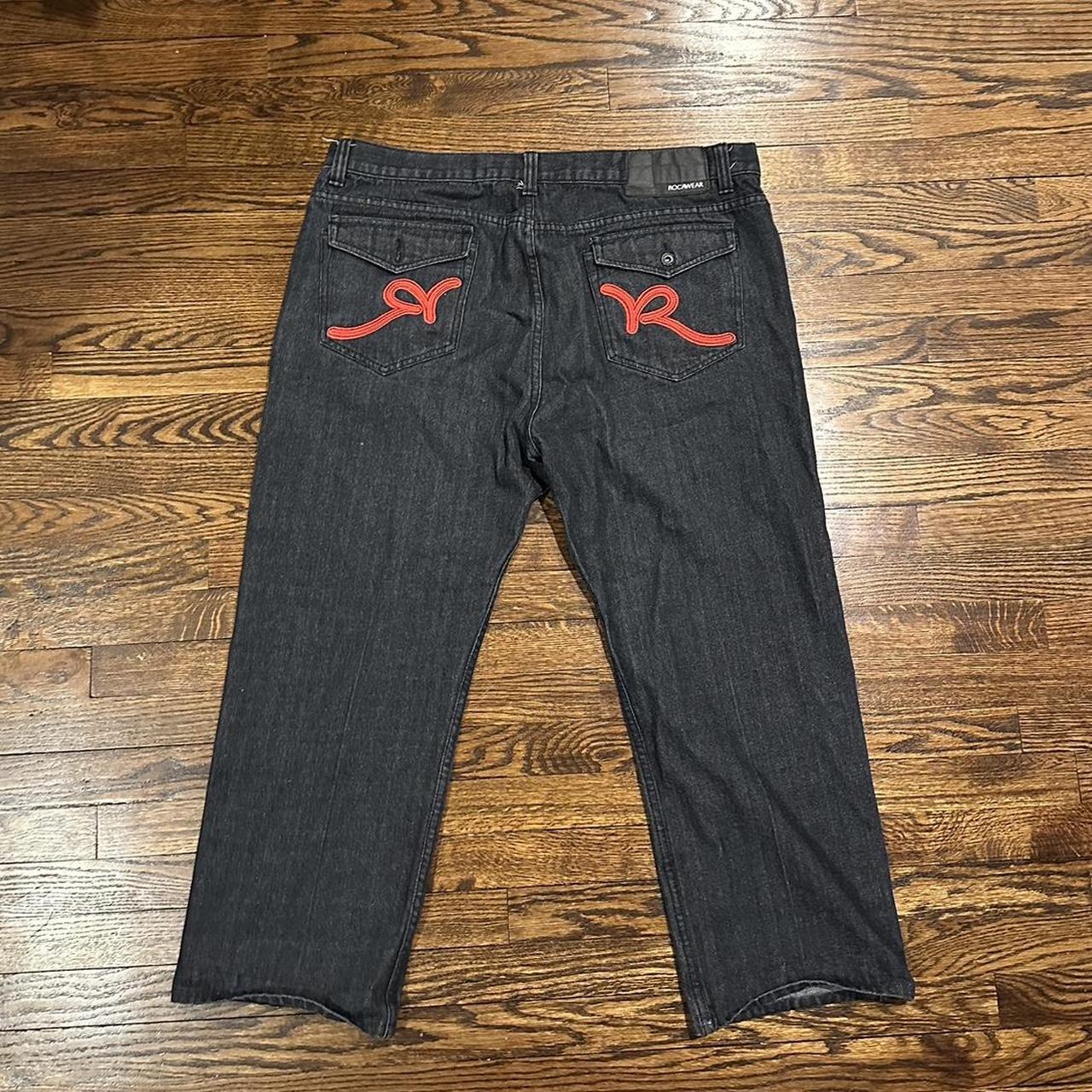 Super fire rocawear black pants with cool patch work... Depop