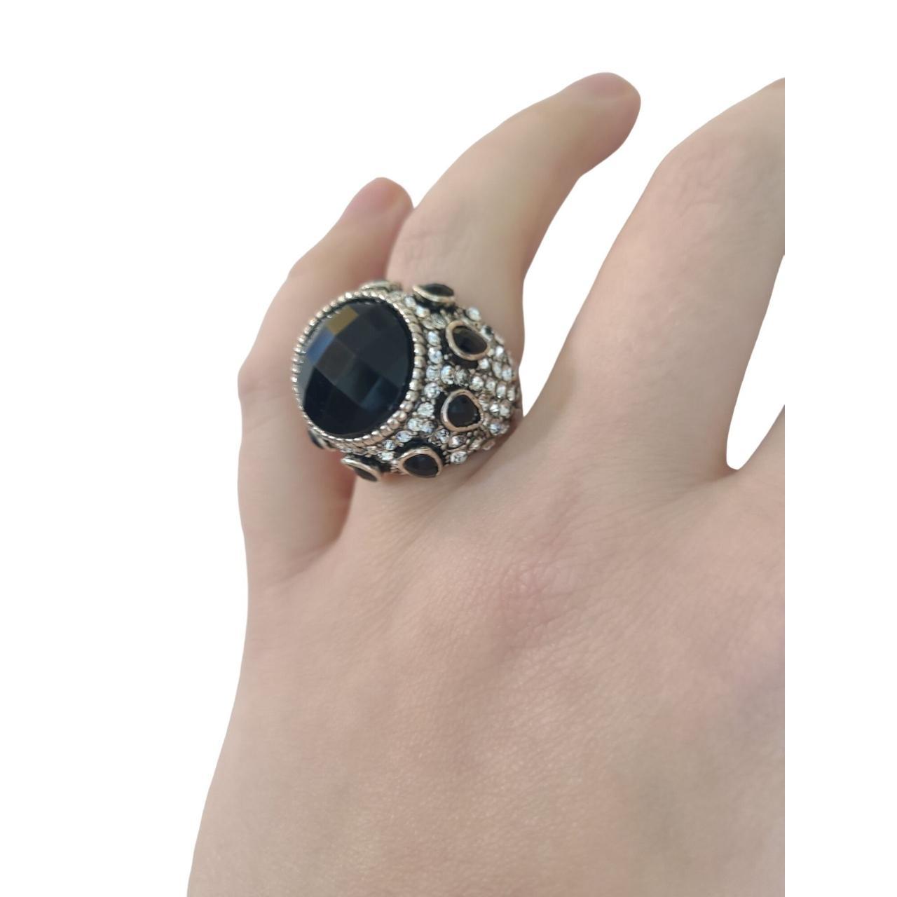 Unique black and silver ring. The ring is size 7.... - Depop