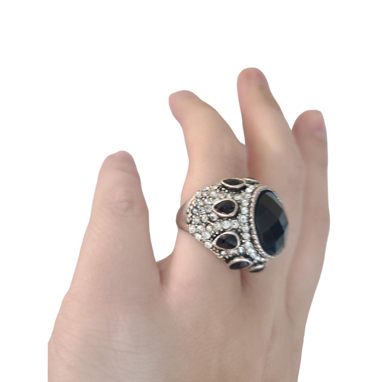 Unique black and silver ring. The ring is size 7.... - Depop