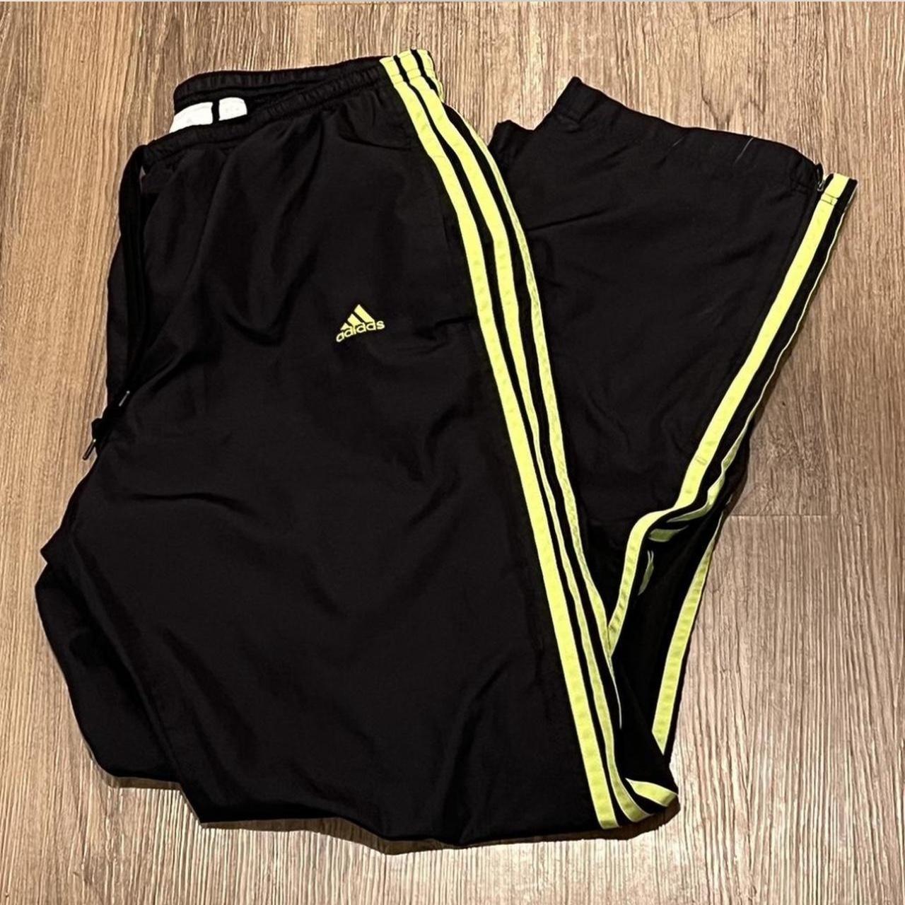 Black adidas pants with yellow stripes best sale