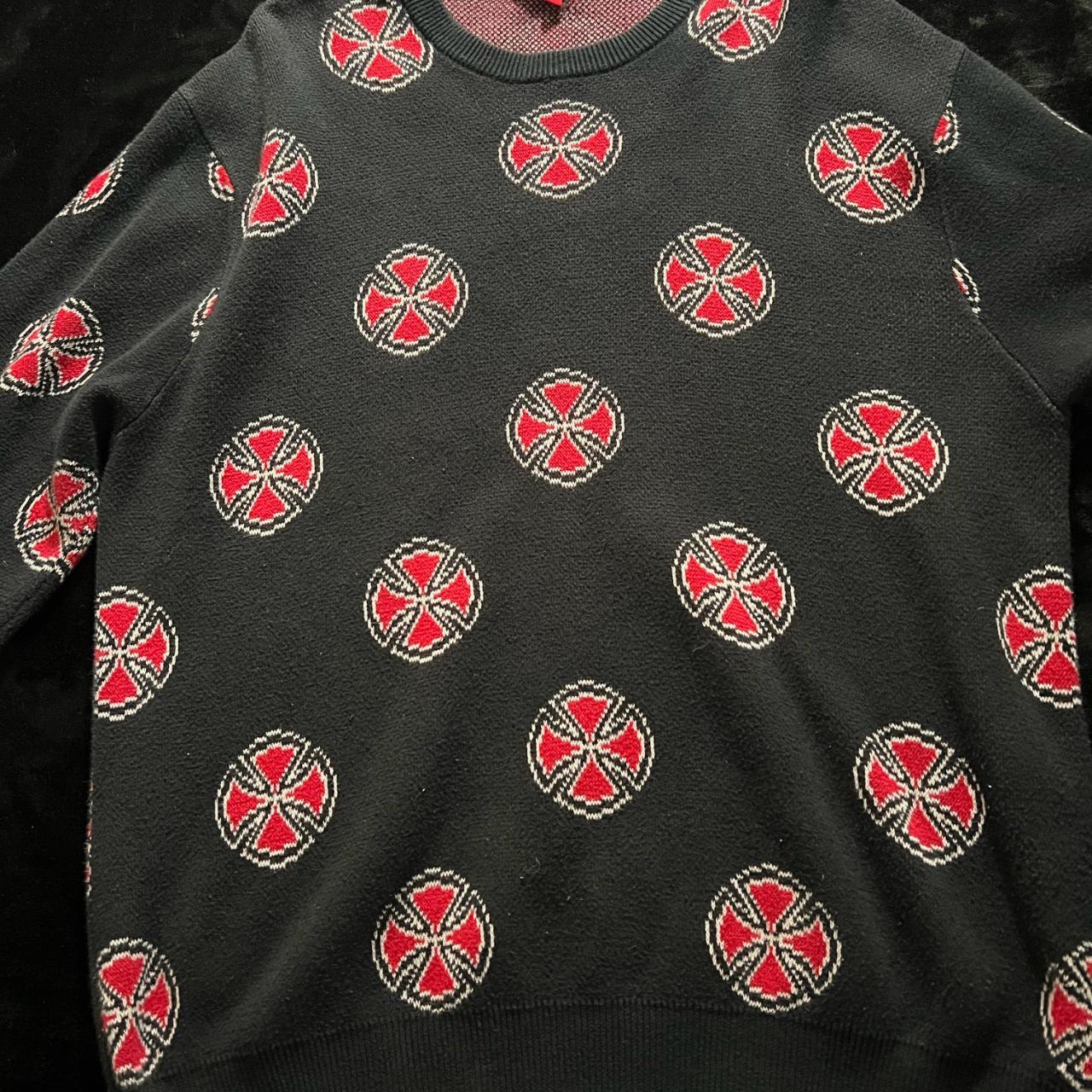 Black jumper outlet with red crosses