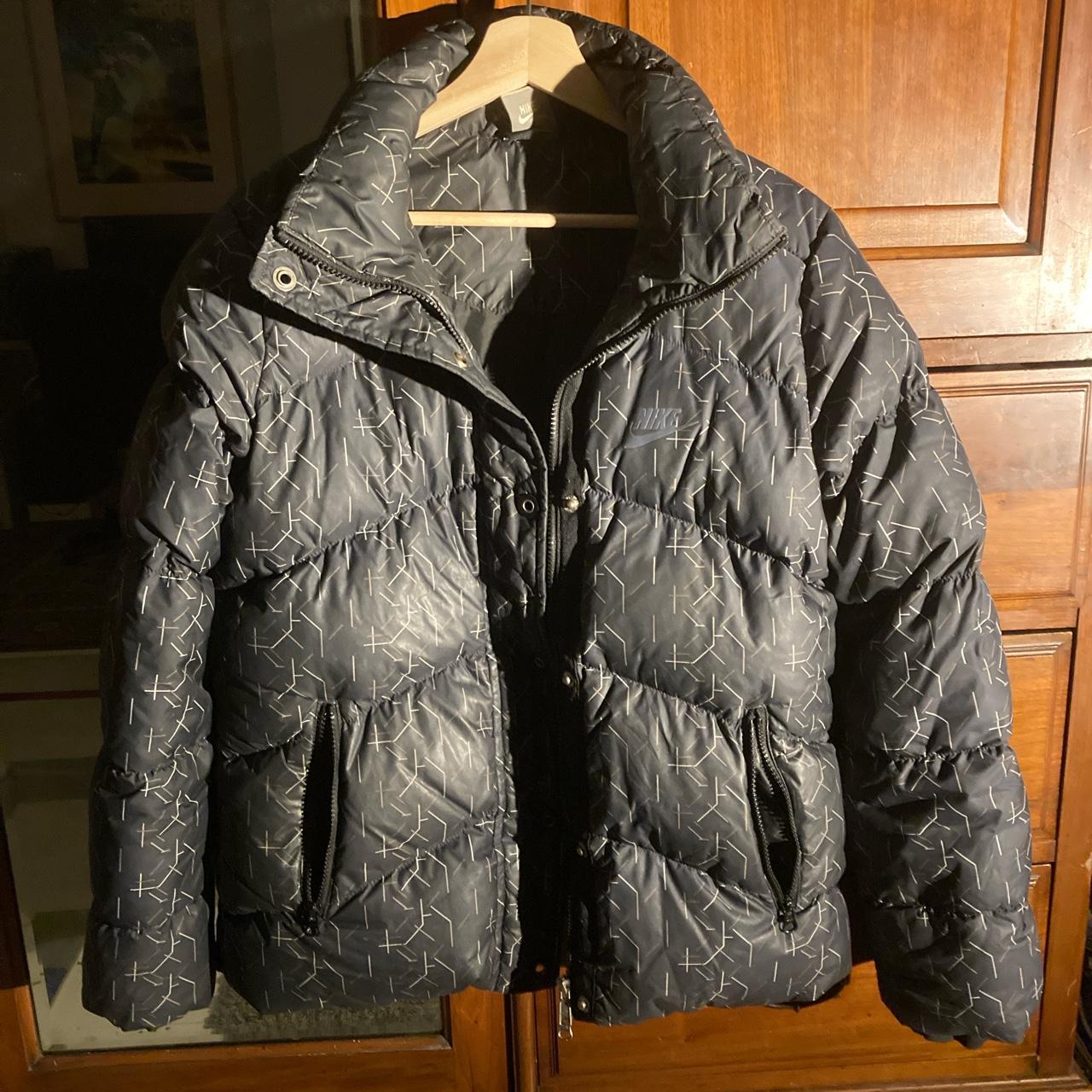 Nike puffer down 550 jacket black with gold and. Depop