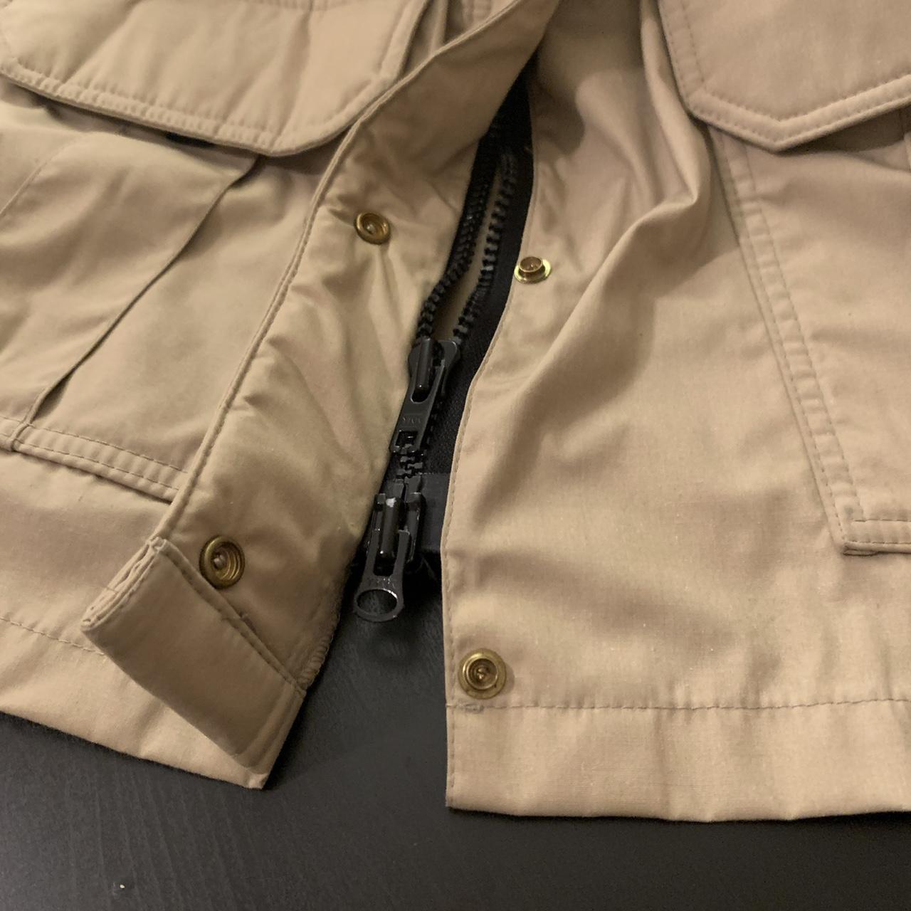 Tan windbreaker with hood from REI. Velcro on the... Depop