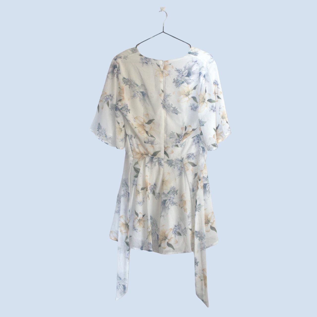 Dotti Spring Floral Dress, featuring a wrap waist,... - Depop