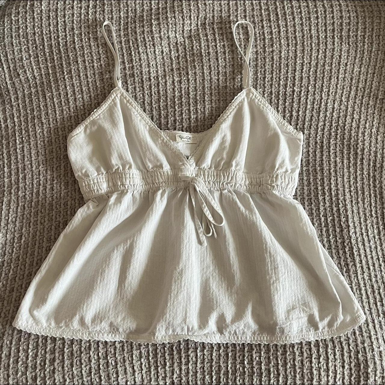 brandy melville white tank with bow! super cute it... Depop
