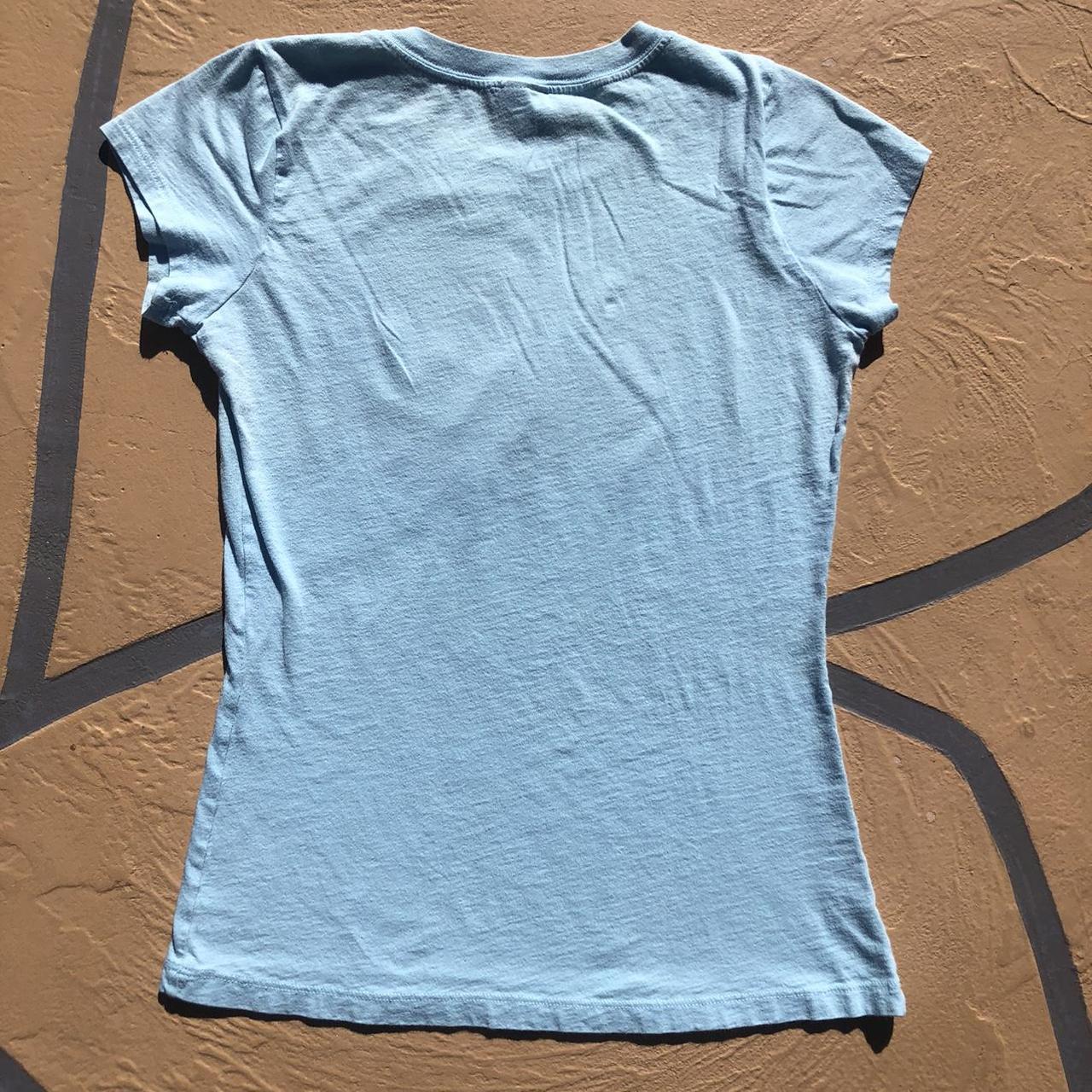 Miken Women's Blue T-shirt | Depop