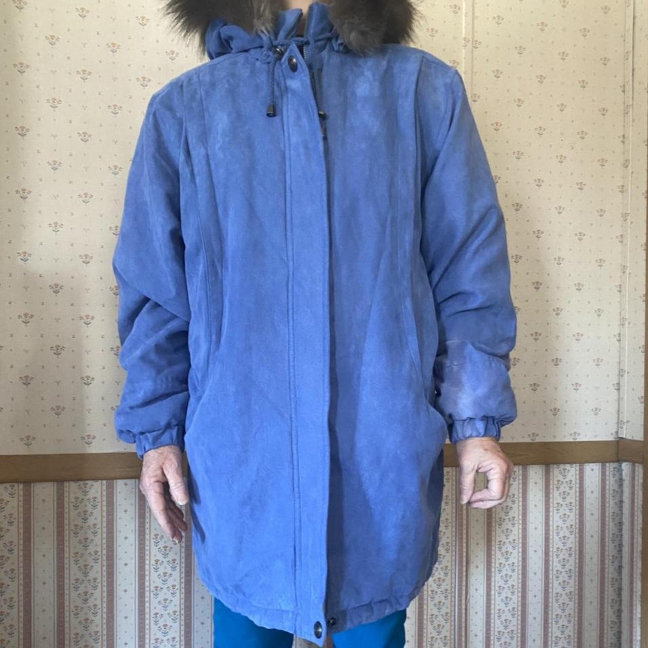 Blue zip up coat with fluffy hood. Has pockets and... Depop