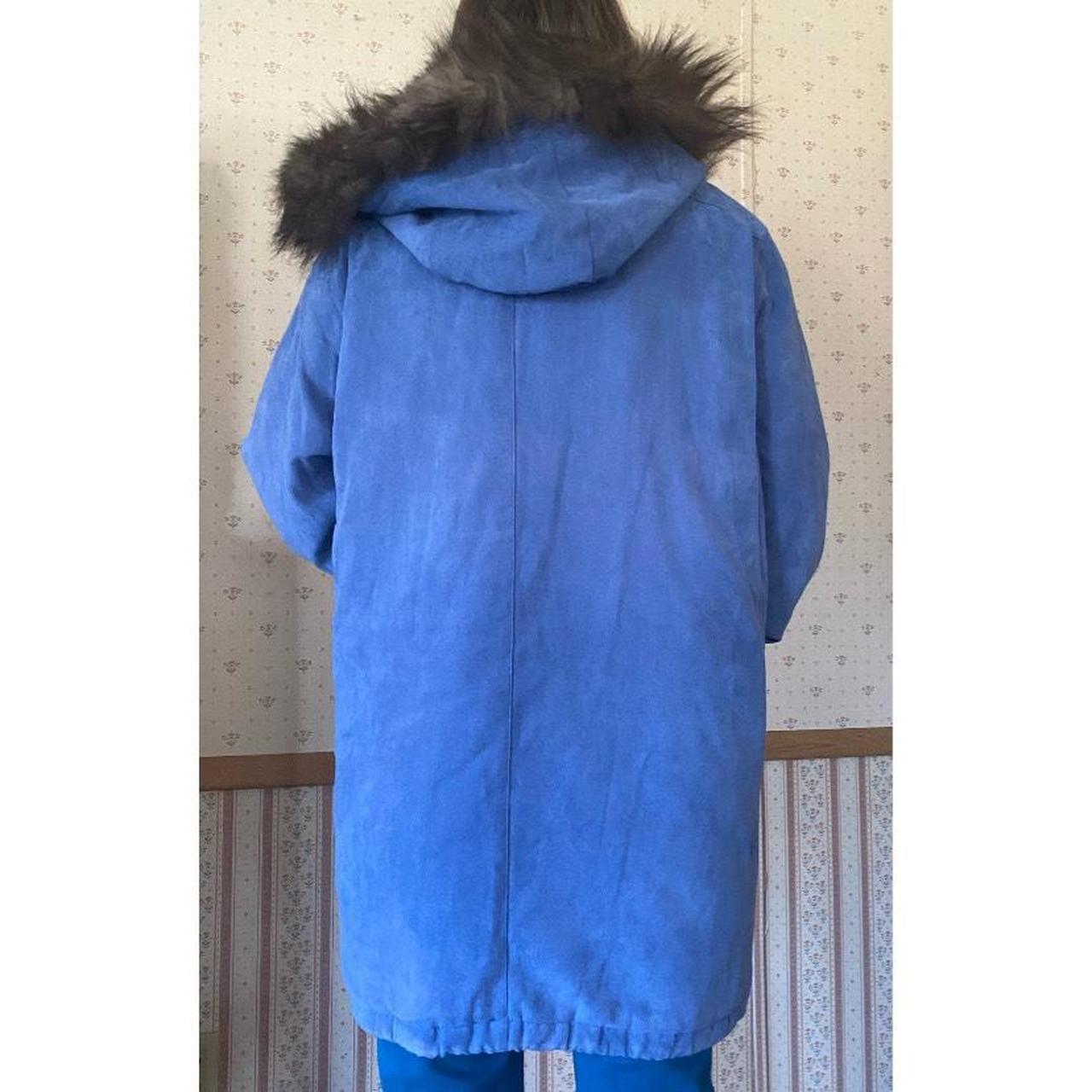 Blue zip up coat with fluffy hood. Has pockets and... Depop