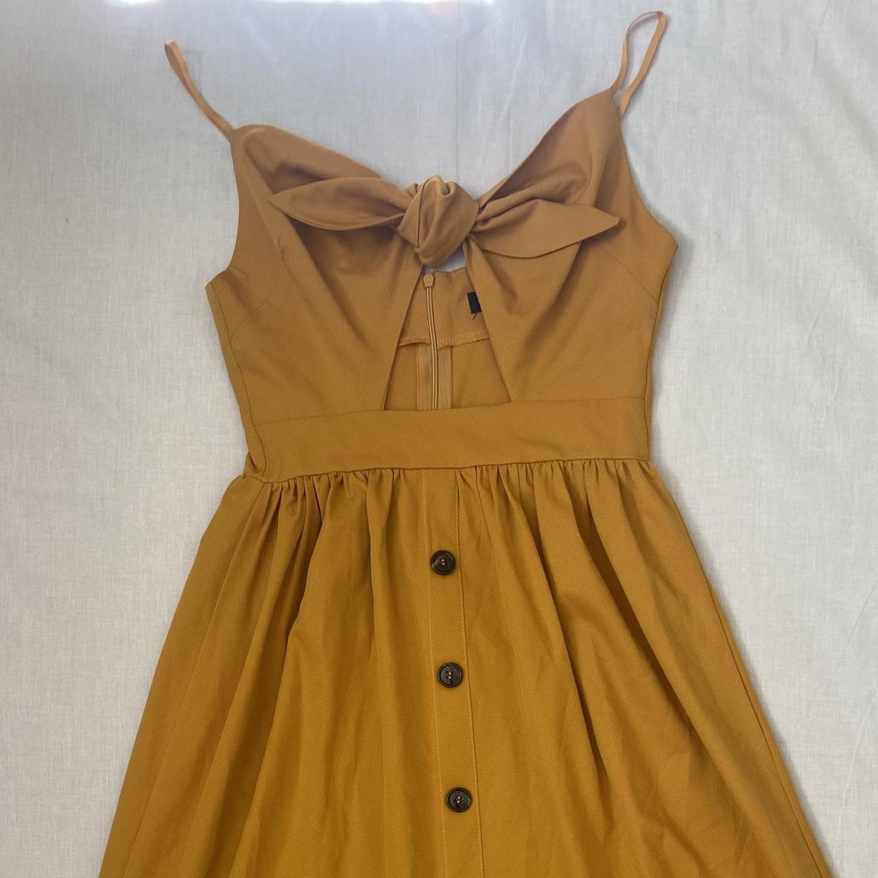 Mustard yellow dress with a bow and buttons and a. Depop