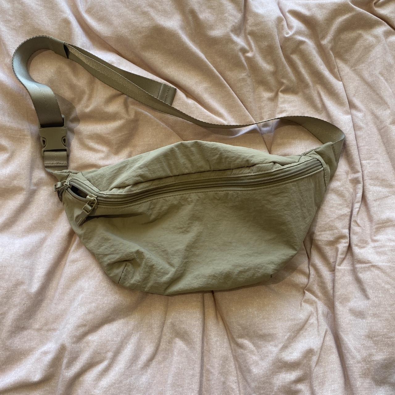 uniqlo fanny pack in a light khaki colour (its much... - Depop