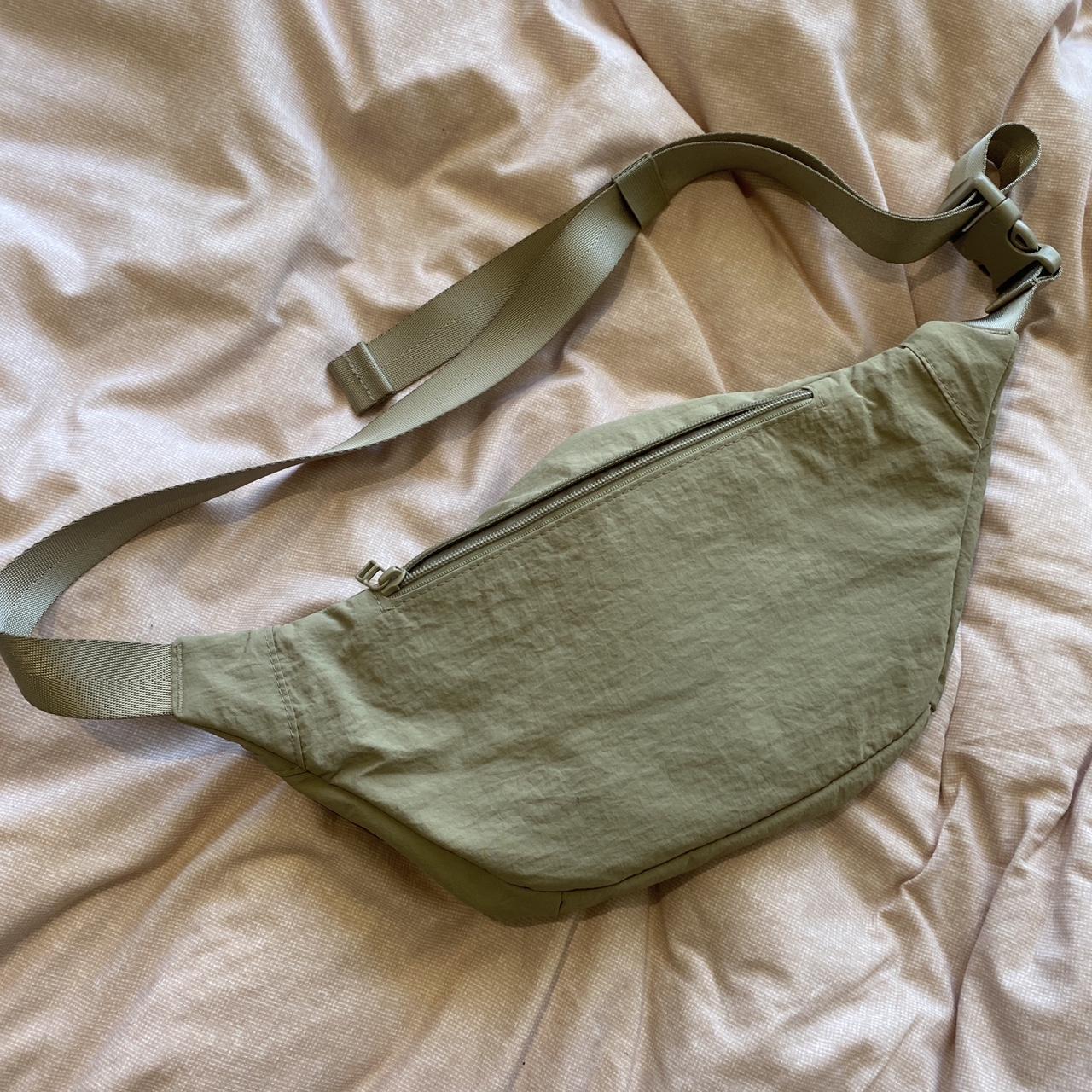 uniqlo fanny pack in a light khaki colour (its much... - Depop