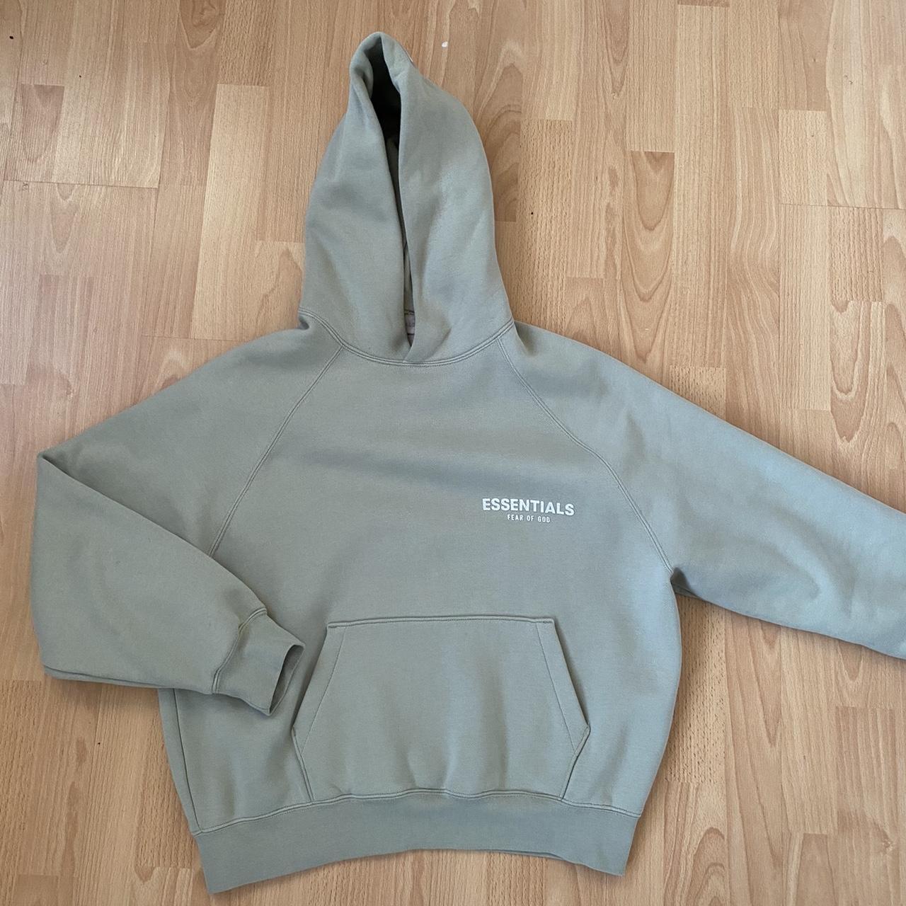 Fear of God Essentials Green Hoodie Condition is... - Depop