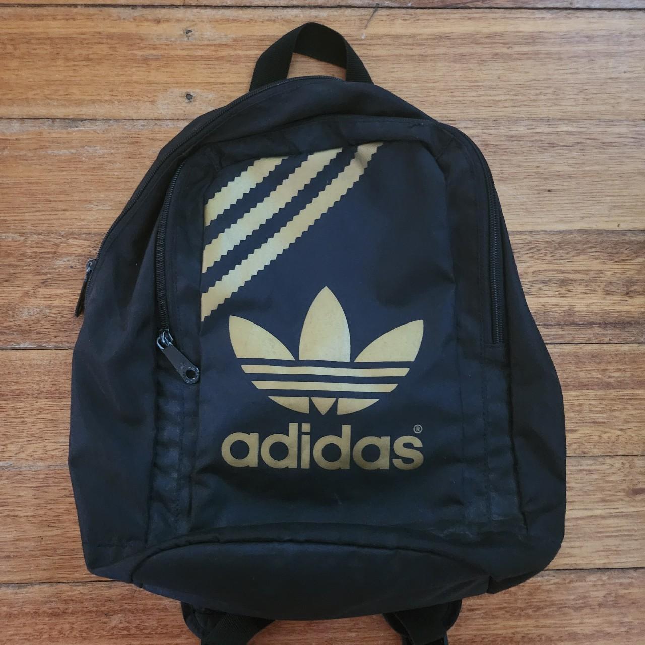 Small black and gold Adidas backpack. 35cm×30cm.... Depop
