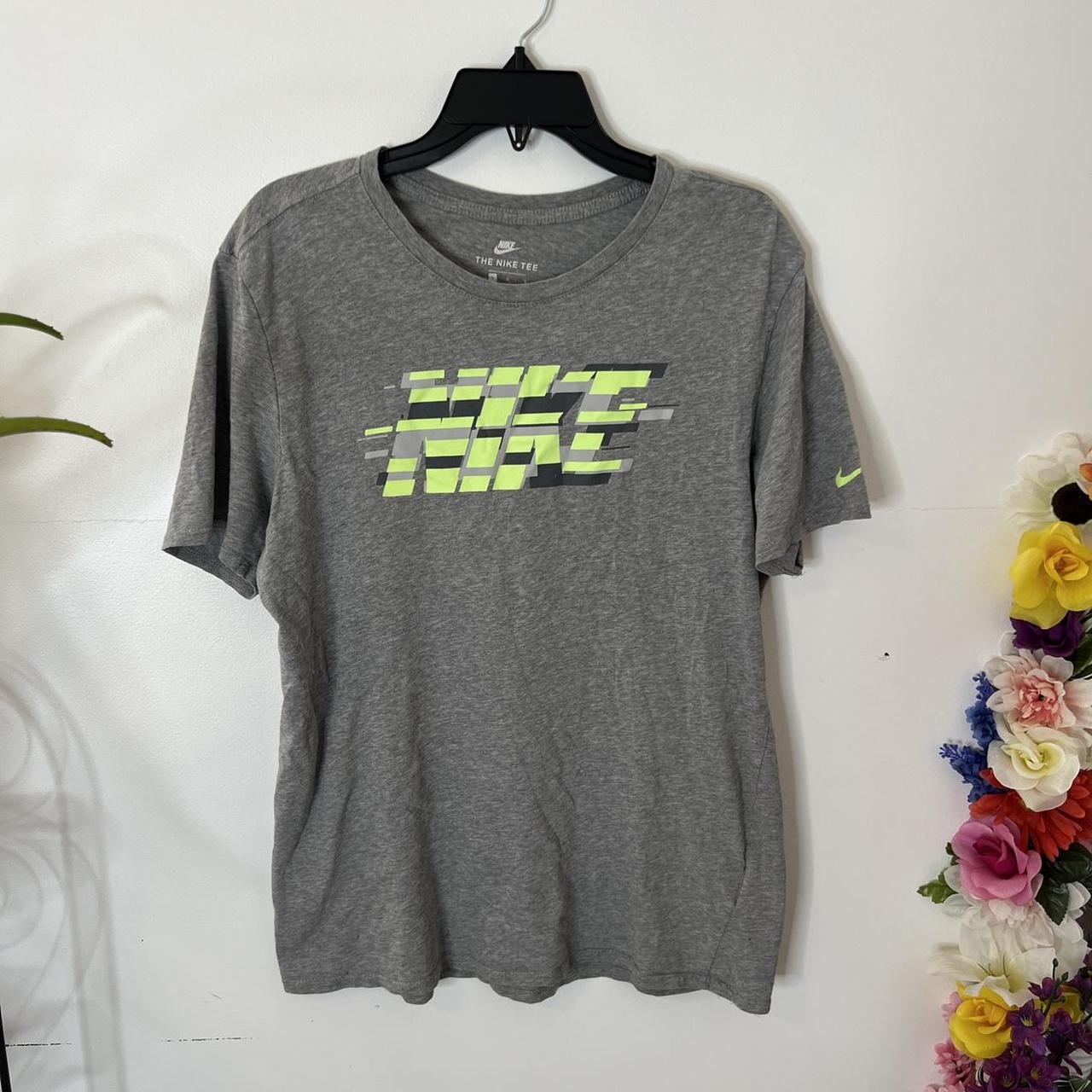 green and gray nike shirt