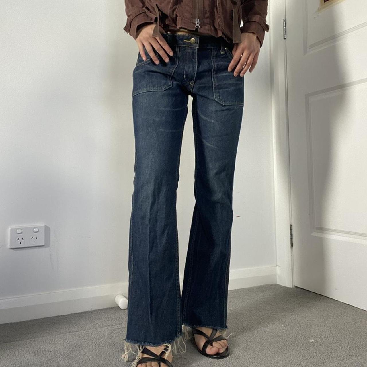 Slightly flared low waisted denim jeans with frayed... - Depop