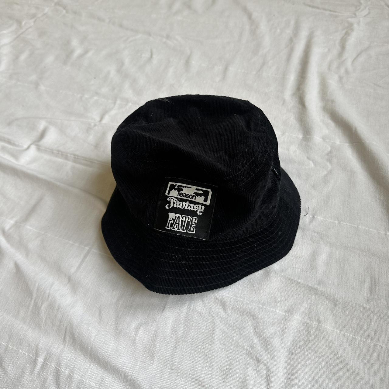 Black cord bucket hat with small logo on the front