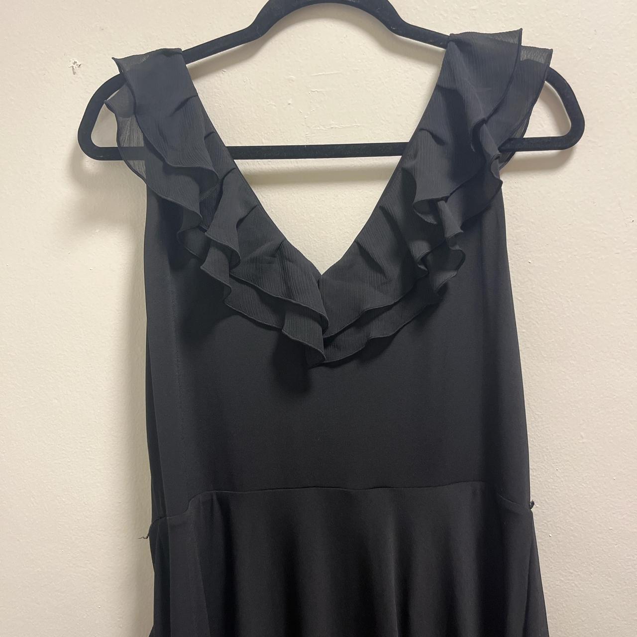 90s black ruffle mini dress with a v-neckline and... - Depop