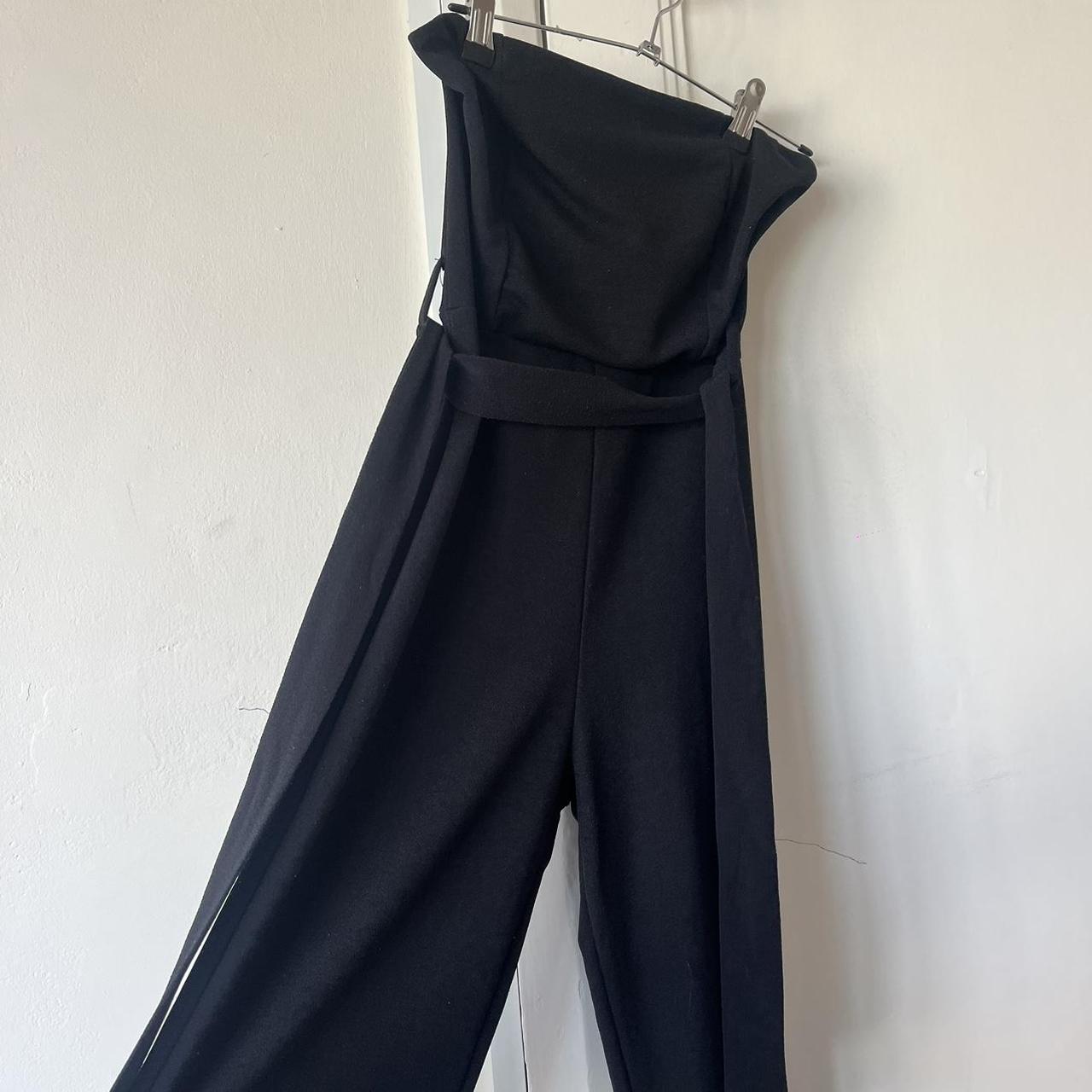 (Worn on left) strapless black jumpsuit with belt... - Depop