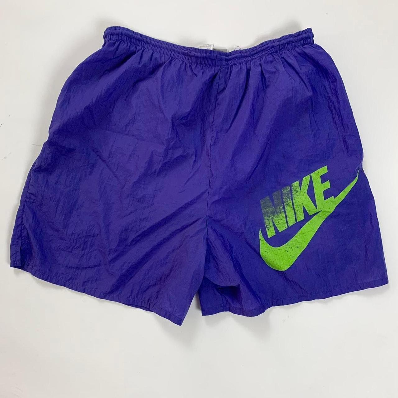 purple and green nike shorts