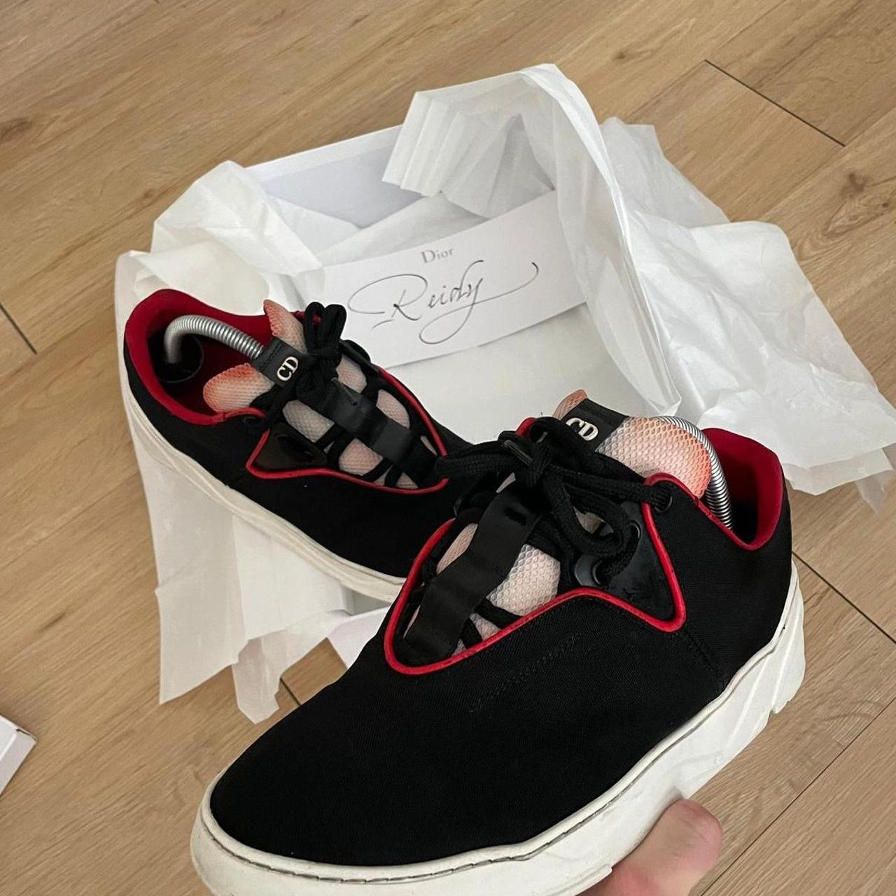 Dior b17 trainers in black and red The colour of