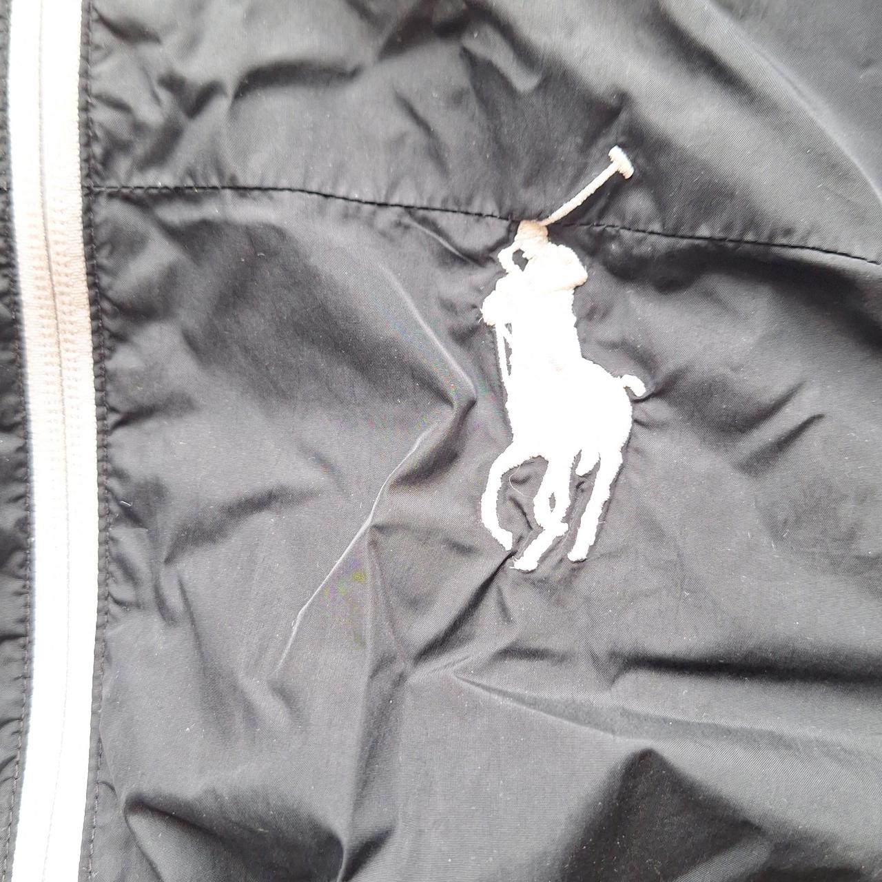 Black polo jacket with white outlet horse